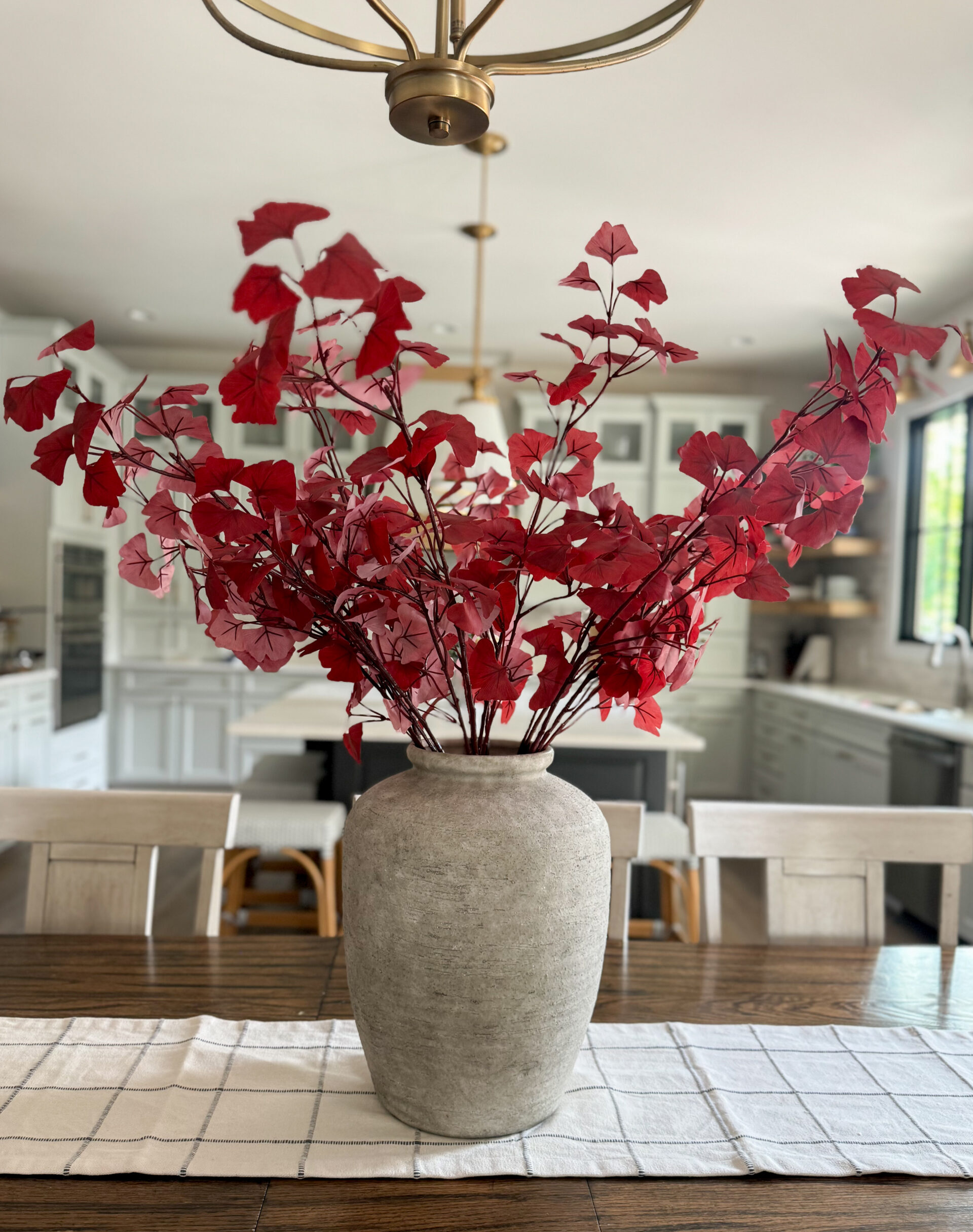 burgundy ginko branches in vase