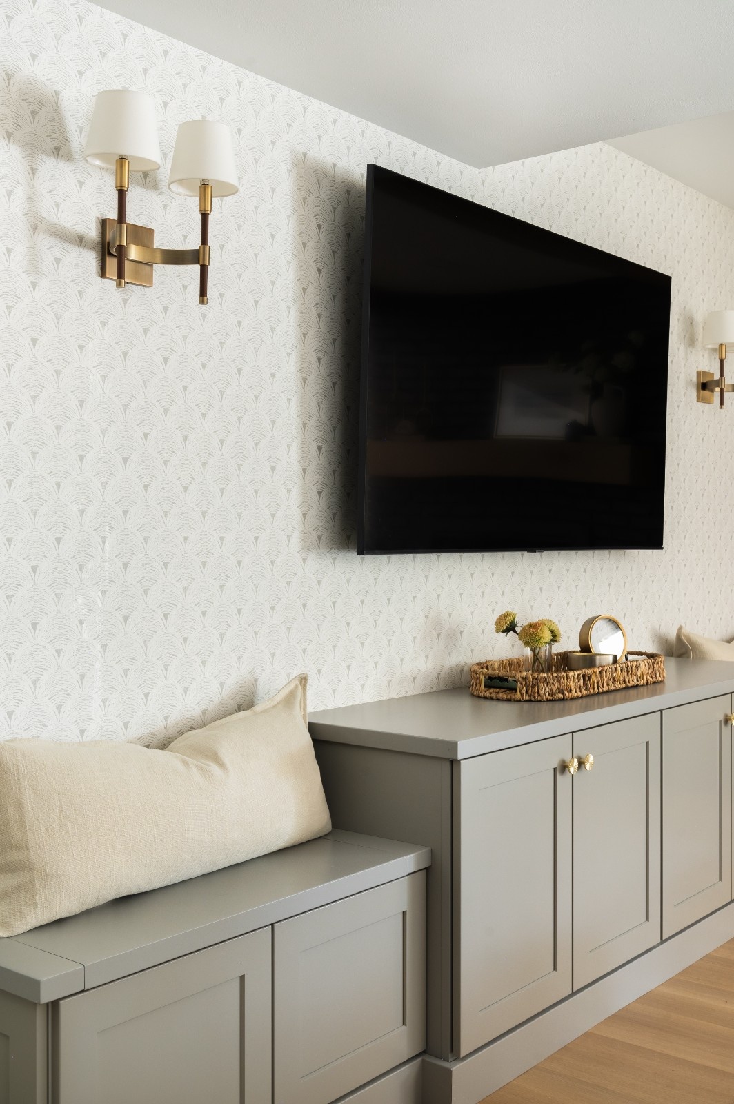 Entertainment wall with wallpaper and sconces